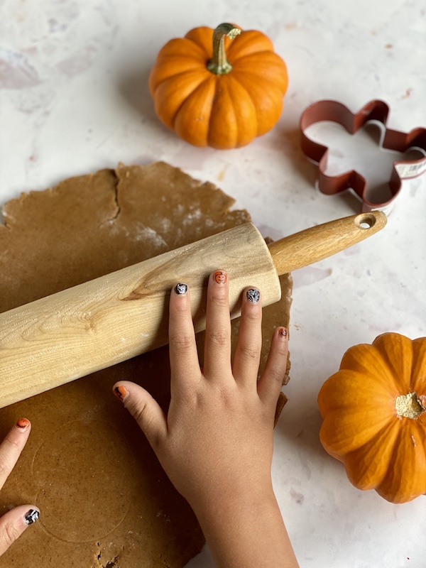 kid hands rolling pin pumpkins