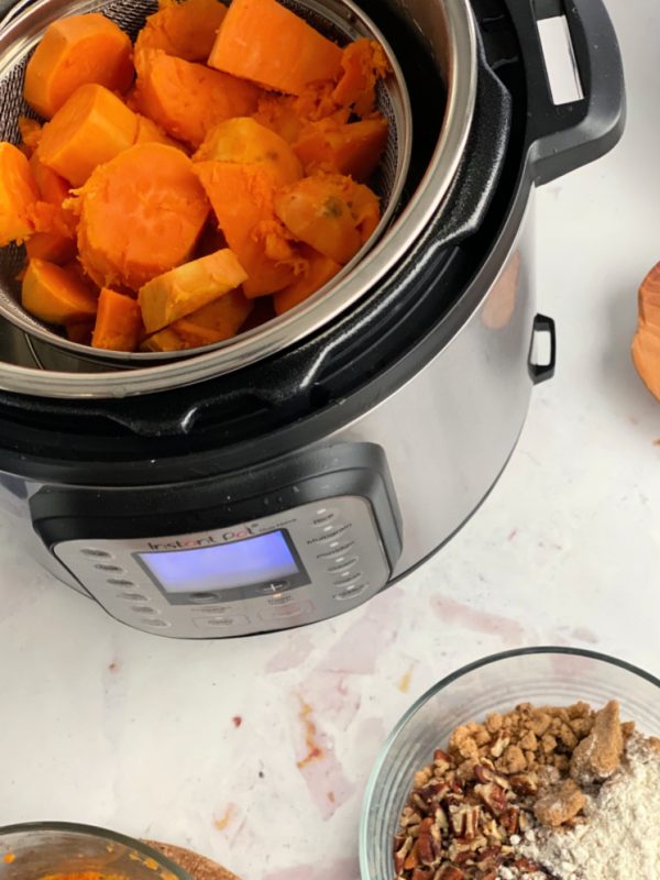cooked sweet potatoes in instant pot with pecan flour topping mixture